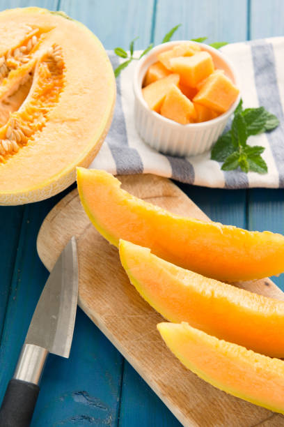 istock cantaloupe melon on the wooden table 806377906