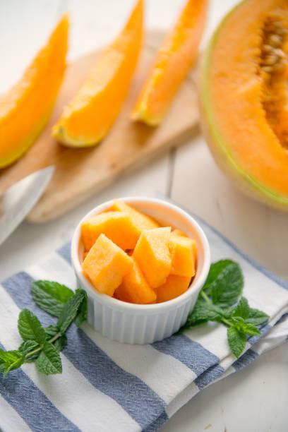 istock cantaloupe melon on the wooden table 806380094