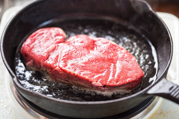 istock Raw angus steak fried on vegetable oil, iron cast 806391706