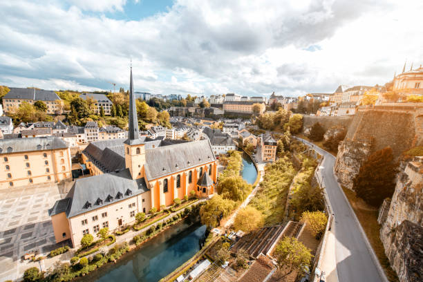 The old town of Luxembourg city Top view on the Grund district with saint Johns church and Neumunster abbey in Luxembourg city luxemburg stock pictures, royalty-free photos & images