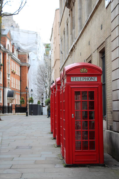 istock Old red telephone boxes on London, UK 806426162