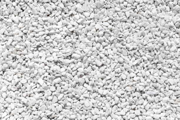 istock Natural matte white color pebble stones. background image, texture 806431344