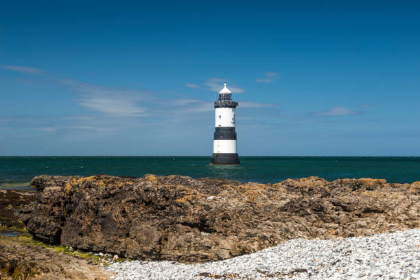 istock Penmon Lighthouse - Blue skies and calm seas. 806436060