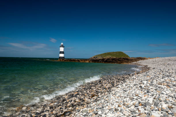 istock Penmon Lighthouse - Blue skies and calm seas. 806439390