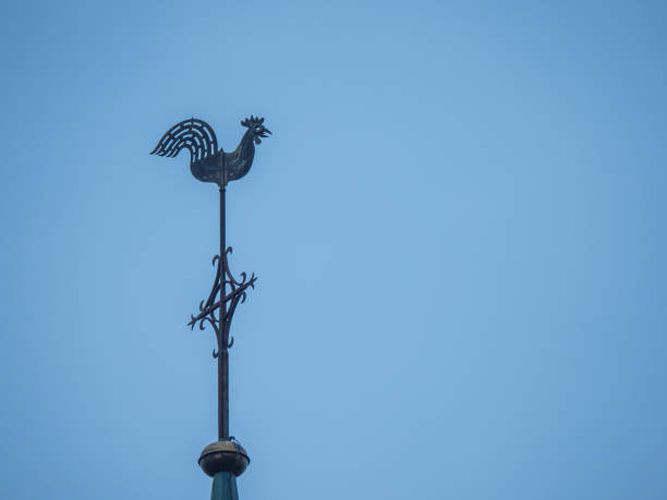 istock church spire with weathercock and blue sky 806451778