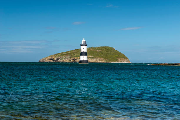 istock Penmon Lighthouse - Blue skies and calm seas. 806456470