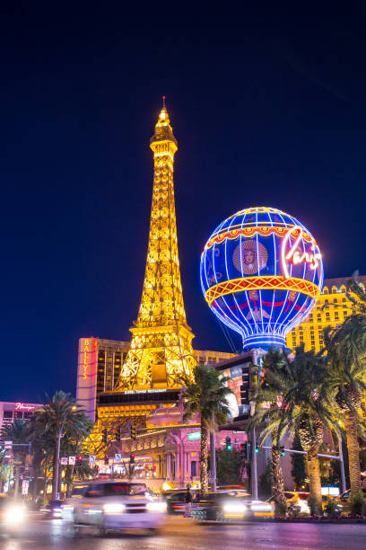 Las Vegas, USA - May 23, 2022:  Eiffel tower in neon light in the evening in Las Vegas.  It is a half scale, 540-foot (164.6 m) tall replica of the Eiffel Tower in Paris.