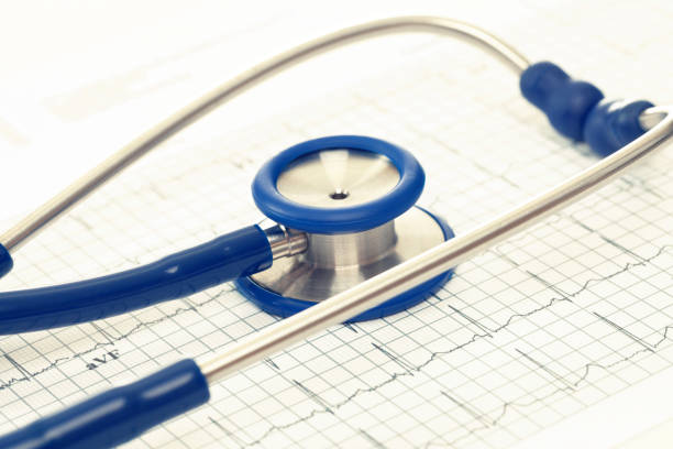 istock Stethoscope and ekg cardiograms chart. Filtered image: cross processed vintage effect. 806468816