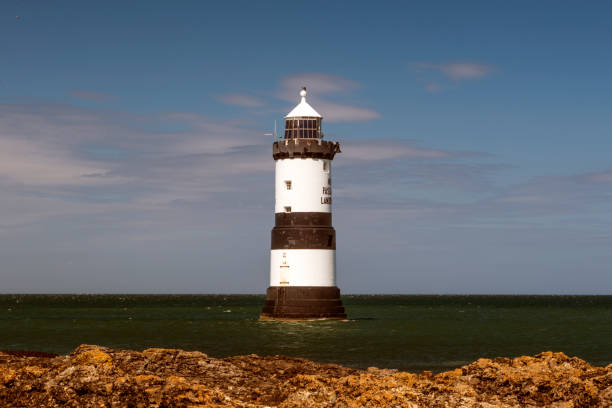 istock Penmon Lighthouse - Blue skies and calm seas. 806468872