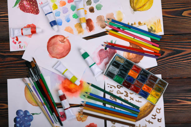 istock Child is drawing a big red heart on white paper. 806476130