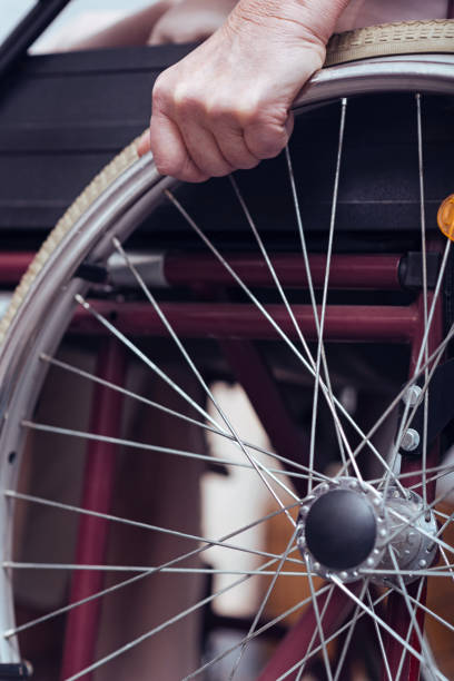 istock Disabled elderly woman using wheelchair at home 806476552