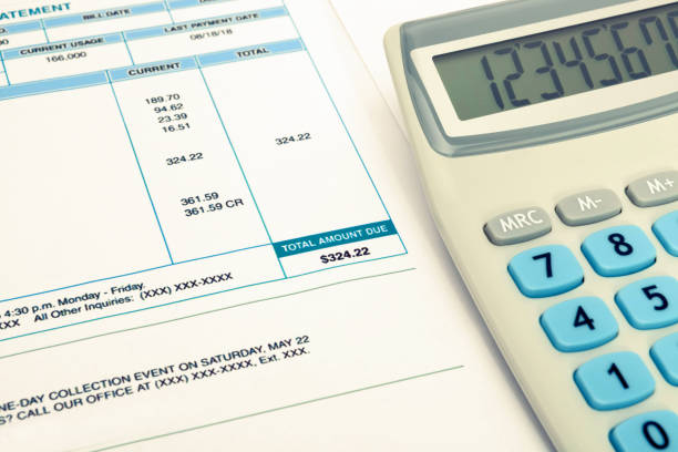 istock Unpaid utility bill and calculator over it 806478680