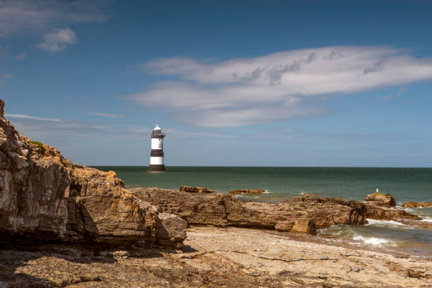 istock Penmon Lighthouse - Blue skies and calm seas. 806478882