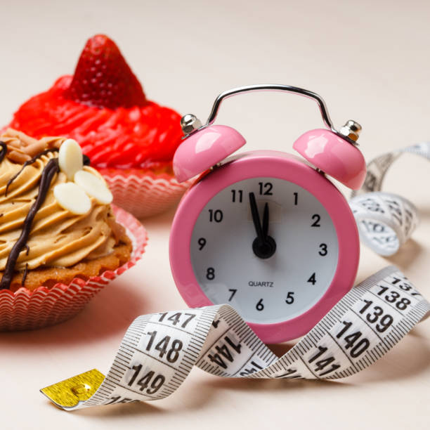istock Sweet food measuring tape and clock on table 806497756