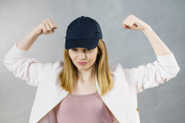 istock Young woman showing her arm muscles 806501844