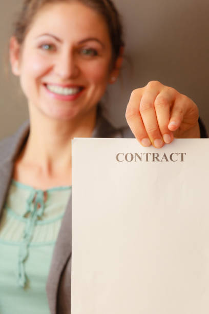 istock Business woman showing contract 806501982
