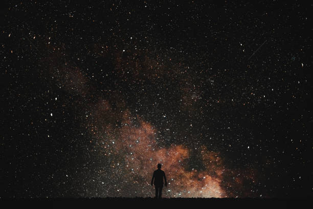 istock Silhouette of man on a background stars. 806518614