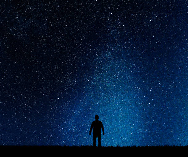 istock Silhouette of man on a background  stars. 806518634