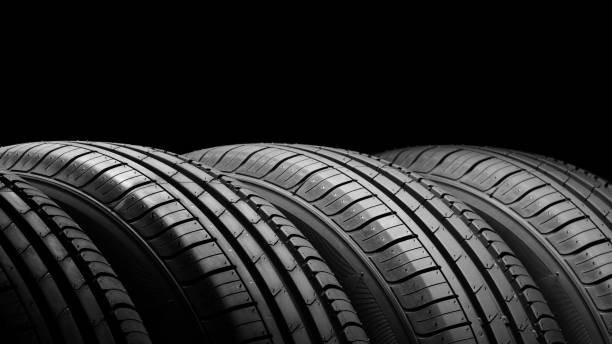 istock Car tires on black background 806523276