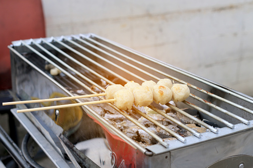Grilled meatballs in the market. Thai Street Food .