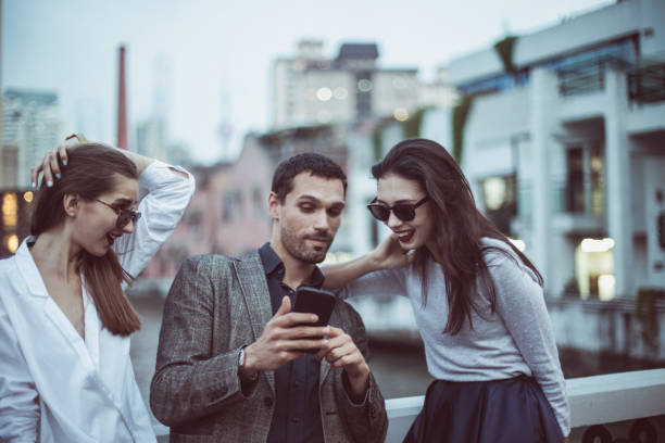 istock Three friends standing on the street 806536588