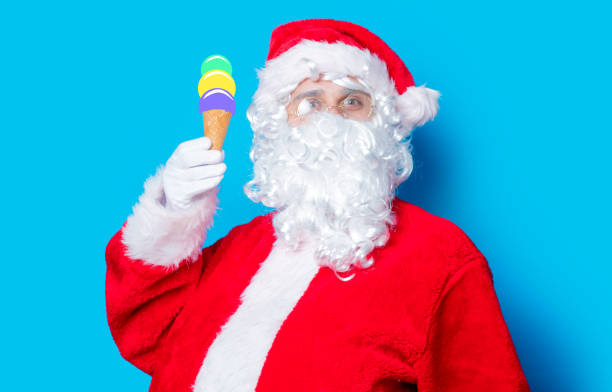 istock Funny Santa Claus have a fun with ice-cream 806550500