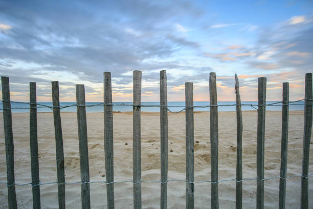 bracking waves along the beachfront during sunny summer day in france