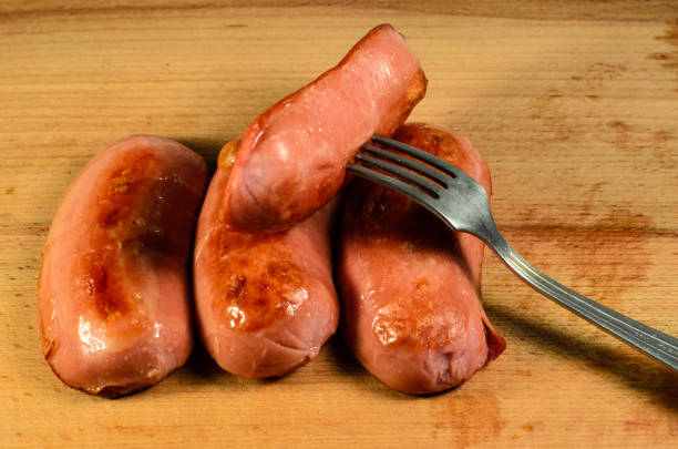 istock Fried sausages on a wooden table 806556958