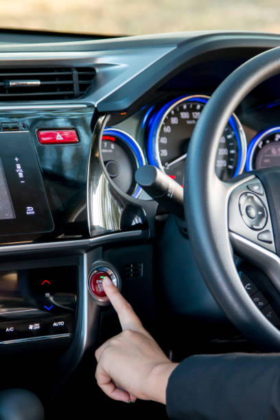 istock Business woman push an engine start or stop button in modern car, close up. 806621694