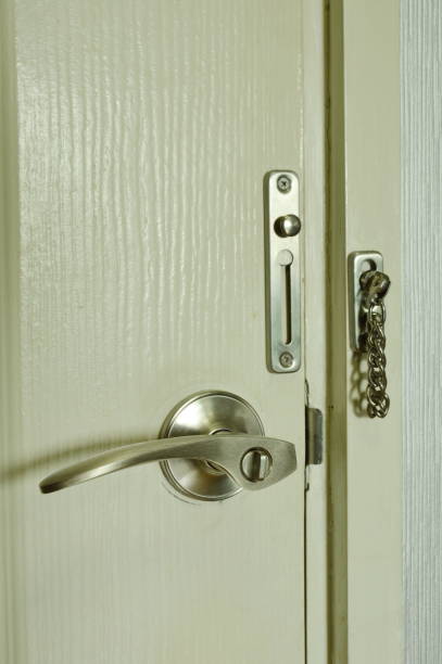 istock door with handle and locked hoop chain 806624412