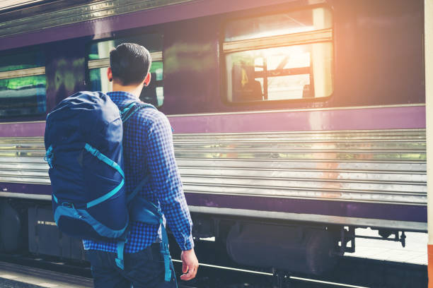 istock Tourist backpacker  to travel at train station 806626600