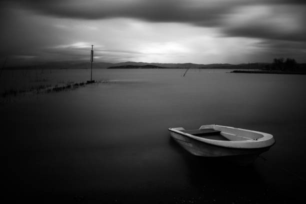 istock Little boat in still water 806654822