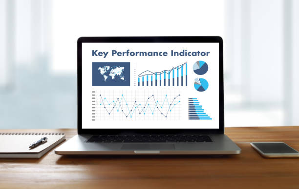 istock KPI acronym (Key Performance Indicator) Business team hands at work with financial reports and a laptop 806665036