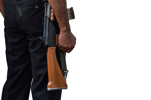 Soldier walking with a assault rifle on white background