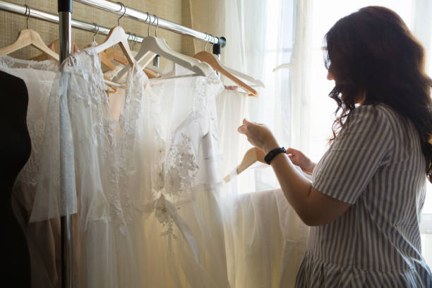 istock Dress designer making lace wedding dresses.Handmade. 806687898