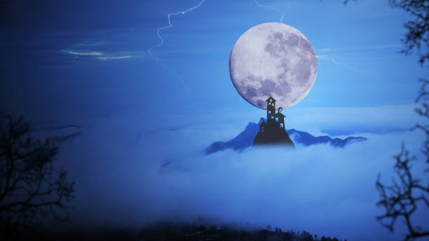 istock Dark castle with dramatic sky,fog, tree, full moon and clouds over mountain. Cool blue tone. 806689214