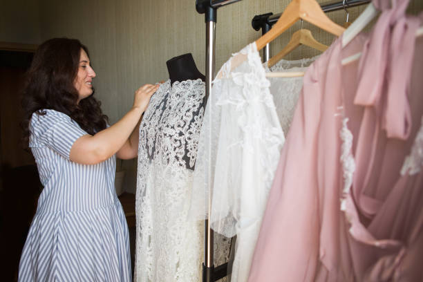 istock Dress designer making lace wedding dresses.Handmade. 806692470