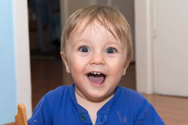istock Cute baby is eating snack 806700858