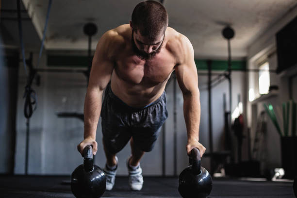 istock Exercising with kettlebell in the gym 806701588