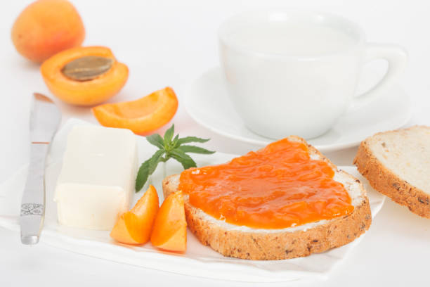 istock Apricot jam, butter and milk for breakfast 806707776