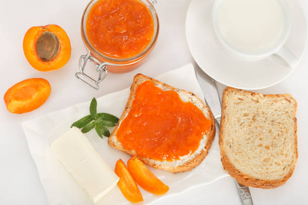 istock Sweet apricot jam on toast for breakfast 806707958