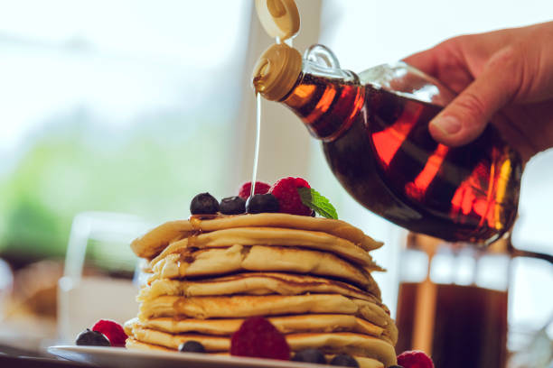 A stack of fried pancakes on a plate. Homemade sweet pancakes. Ready to eat food. Digital watercolor painting