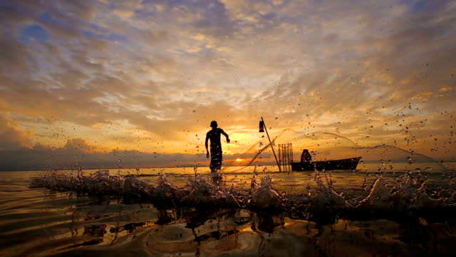 Slow motion of Local lifestyles of fisherman working in the morning sunrise.