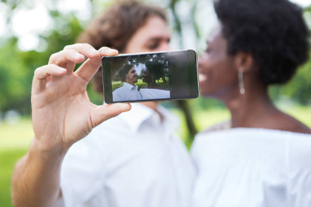 istock Happy young couple taking selfie with smartphone 806730056