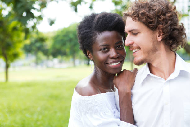 istock Happy young man looking at his girlfriend outdoors 806730134