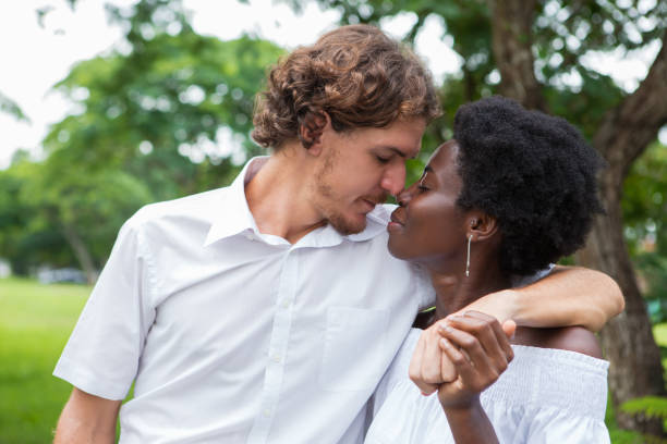 istock Serene young lovers enjoying happy moment in park 806730232