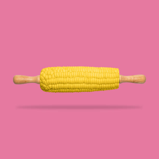 istock Roller corn yellow color on pink background. minimal food concept. Pop color. 806730338