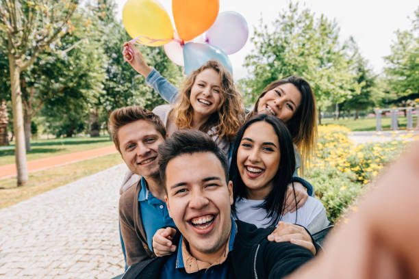 istock Best friends having fun and taking selfie at park 806733774