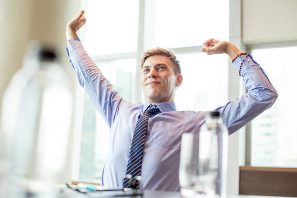 istock Content Business Man Stretching at Office Desk 806733832