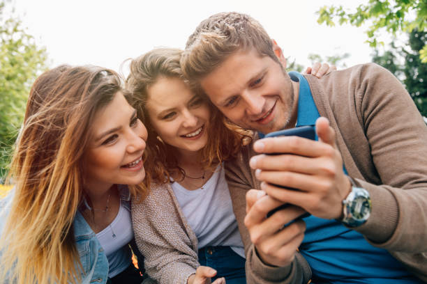 istock Best friends looking at a phone at spring park 806733912